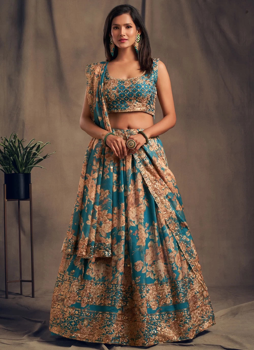 Teal blue zari embroidered organza based lehenga