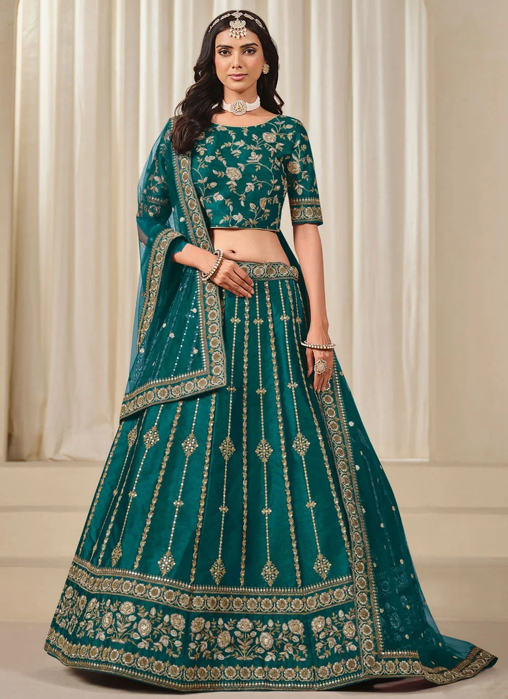 Elegant teal bridesmaid lehenga in art silk with embroidered net dupatta