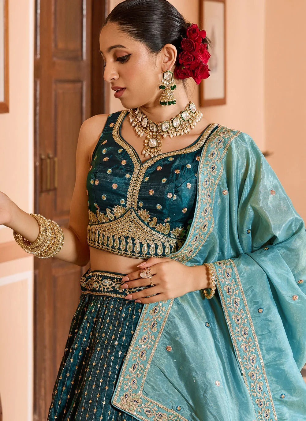 Luxury teal reception lehenga in tissue silk with zari sequins embroidery