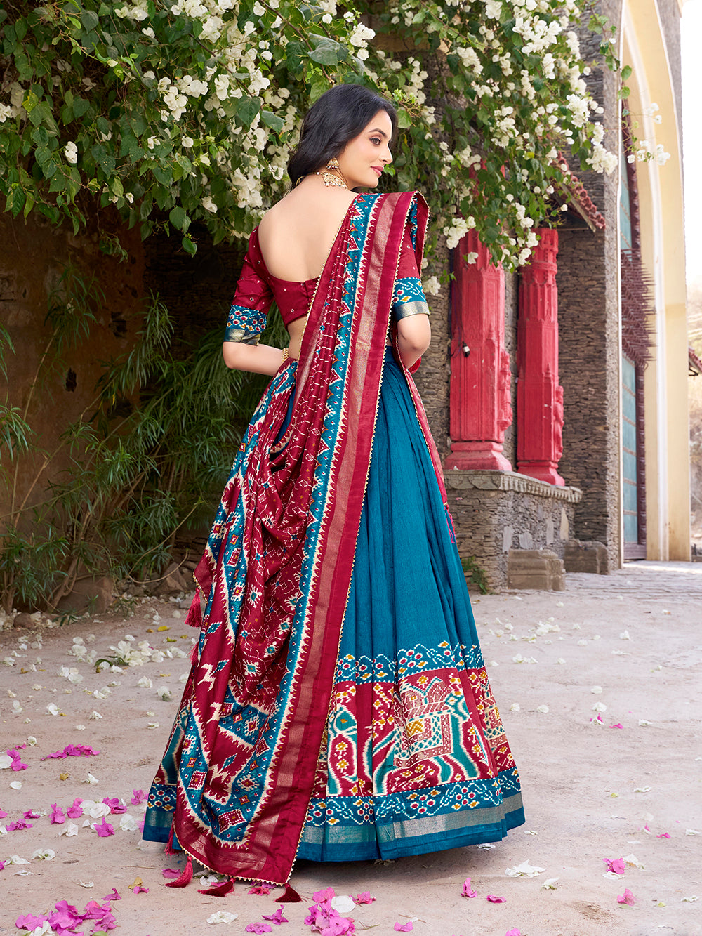 Teal tasar silk lehenga choli with patola print foil work matching dupatta