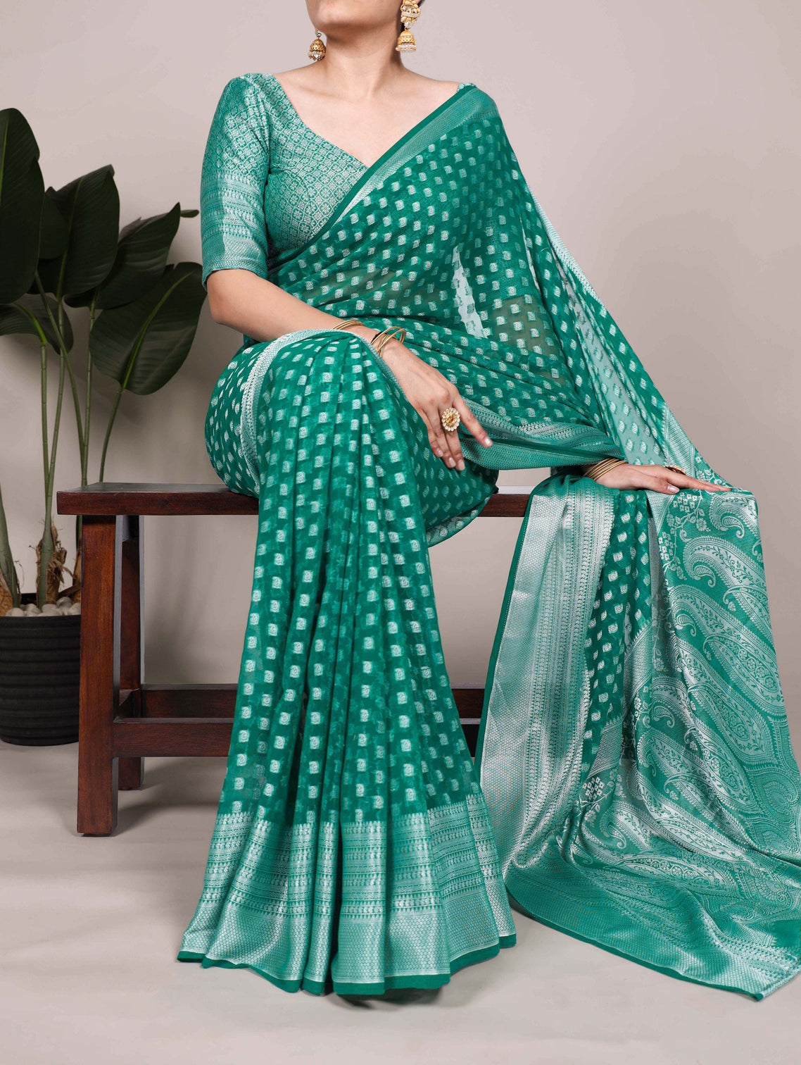 Teal Elegant Nylon Georgette Saree with Zari Weaving & Viscose Border