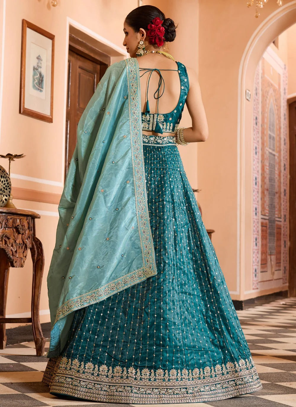 Luxury teal reception lehenga in tissue silk with zari sequins embroidery