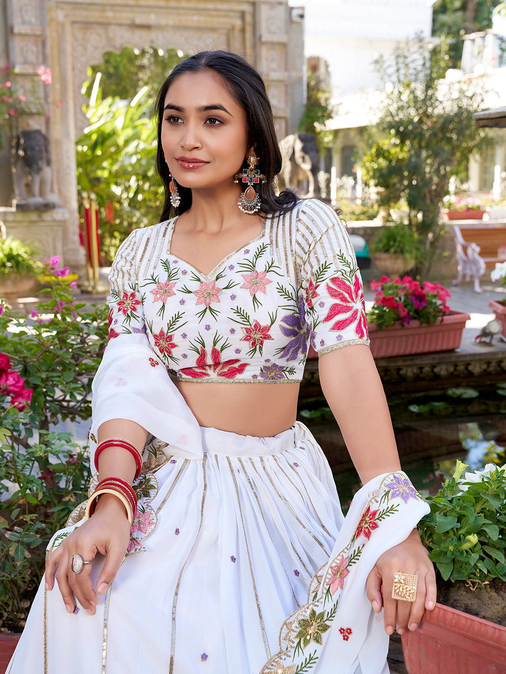 Elegant white georgette wedding lehenga choli with sequins thread embroidery