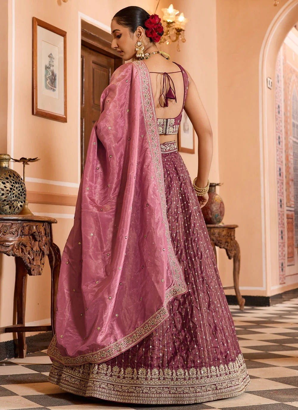 Luxury rose gold engagement lehenga in tissue silk with zari embroidery