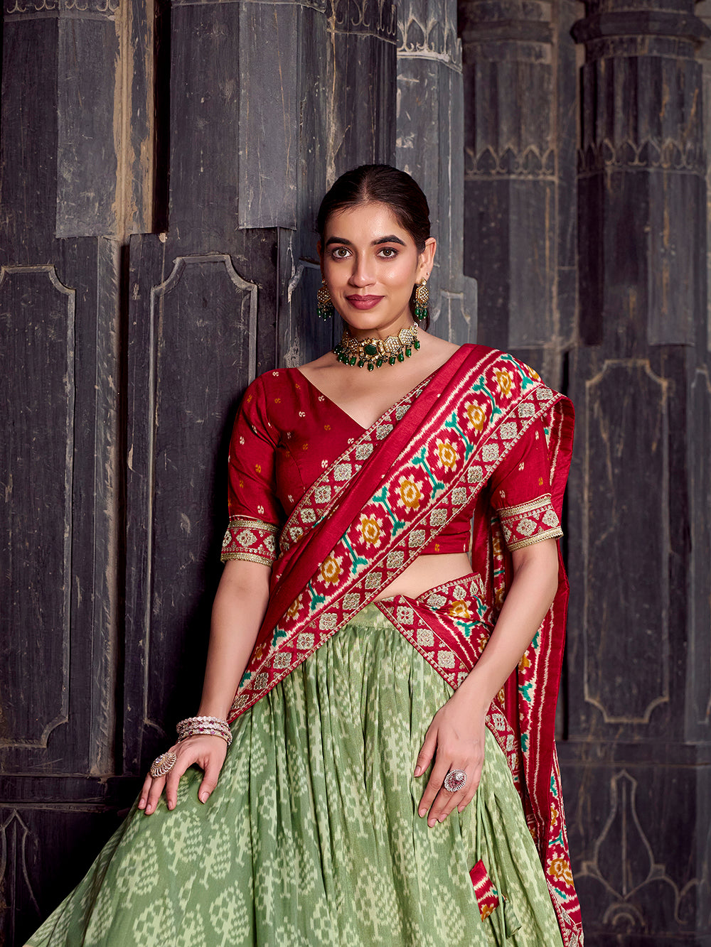 Sea green tasar silk ikat patola print lehenga choli set with red embroidered blouse dupatta