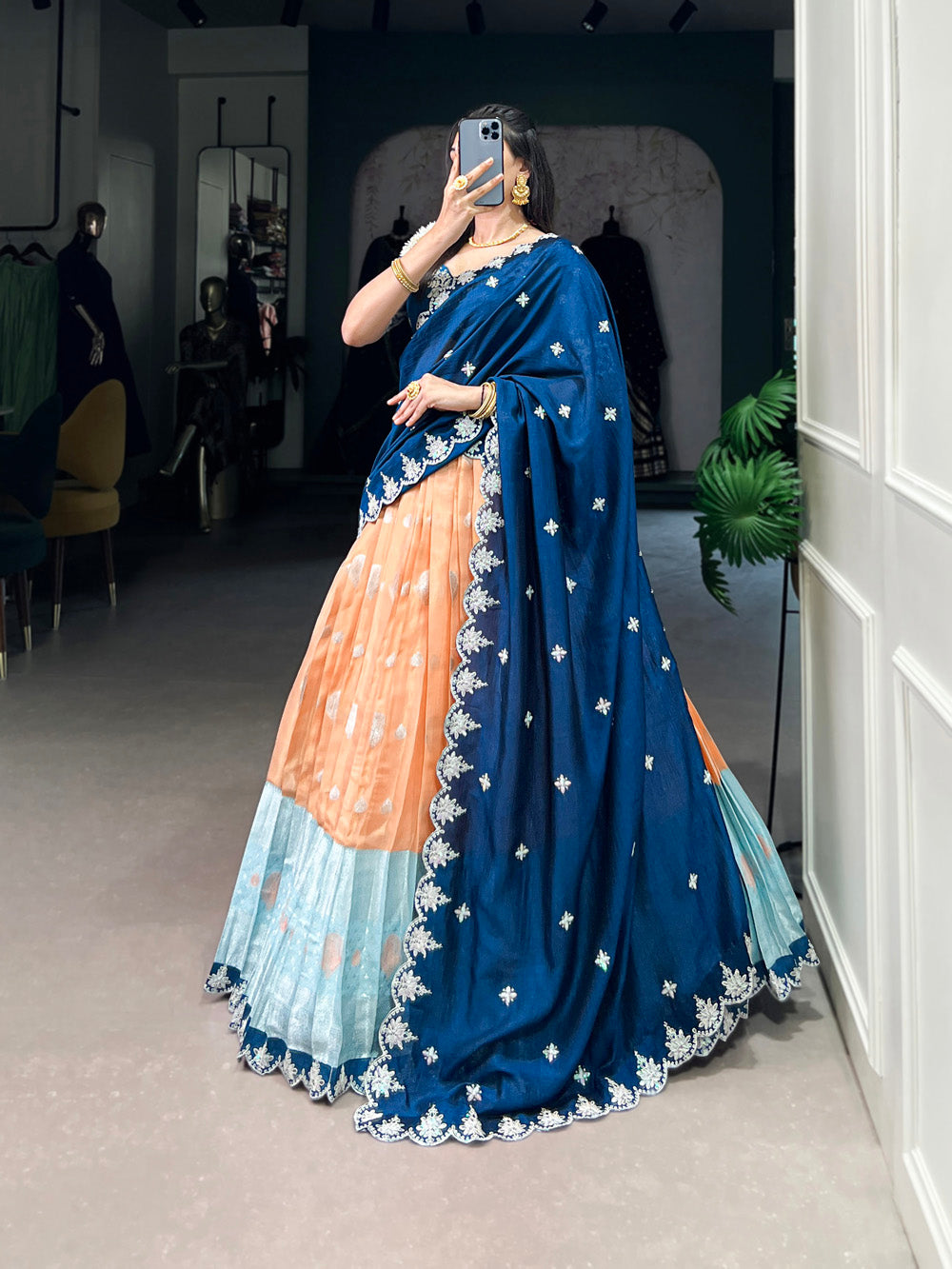 Orange zari kota embroidered lehenga choli with blue vichitra silk dupatta