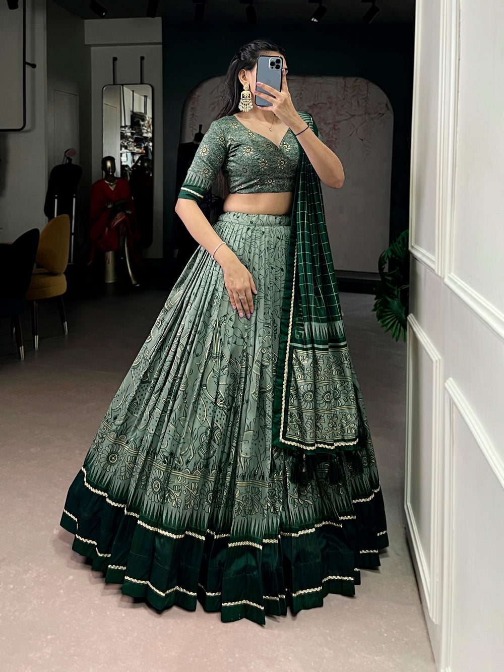 Green tasar silk kalamkari print lehenga choli with lace border tassel dupatta