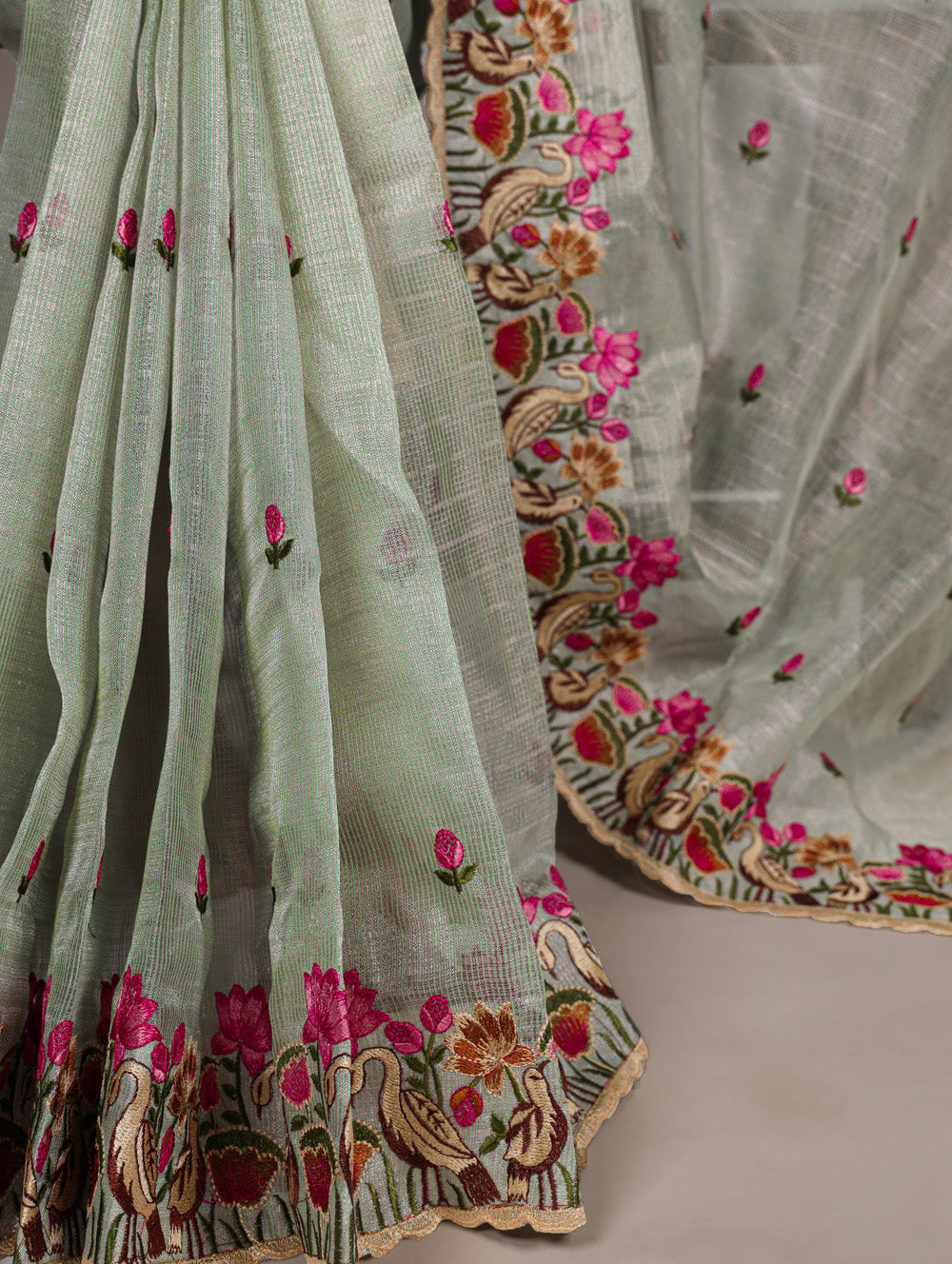 Sea green zari kota tissue saree with floral thread embroidery and banglory blouse fabric