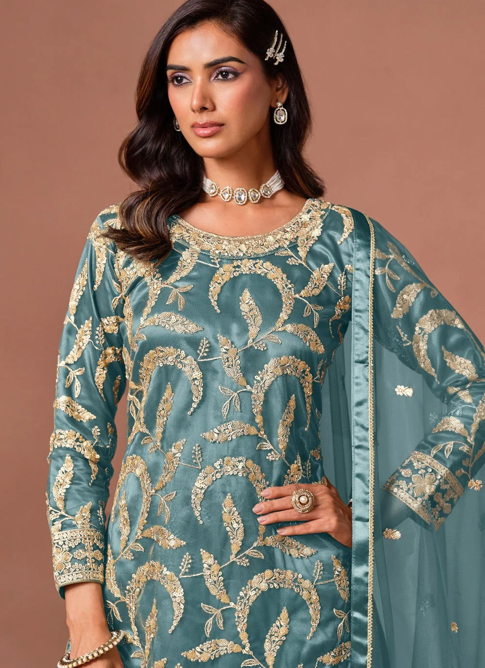 Turquoise embroidered palazzo suit with sequins zari work