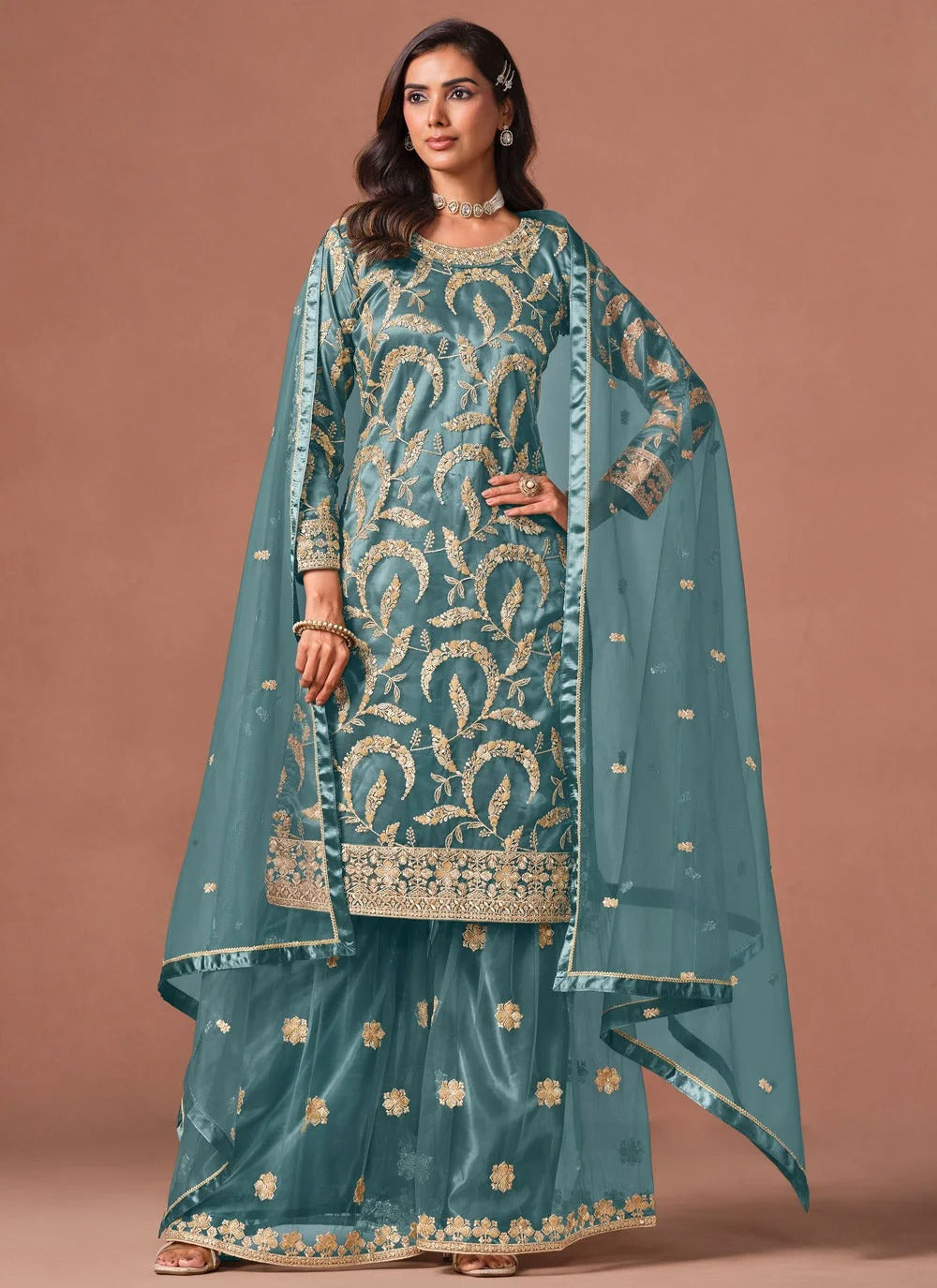 Turquoise embroidered palazzo suit with sequins zari work