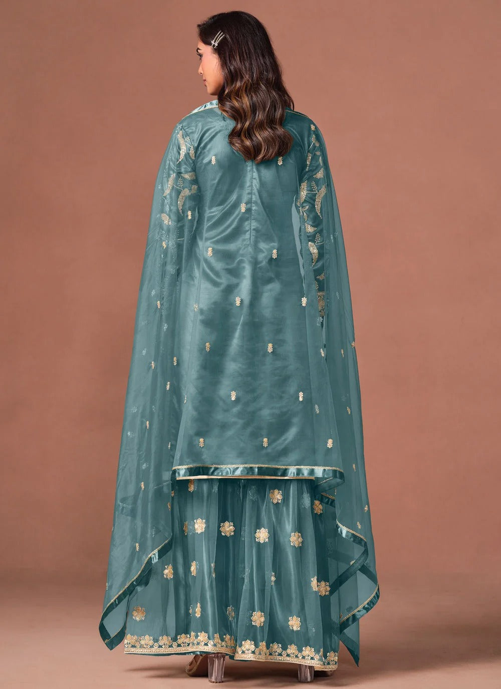 Turquoise embroidered palazzo suit with sequins zari work