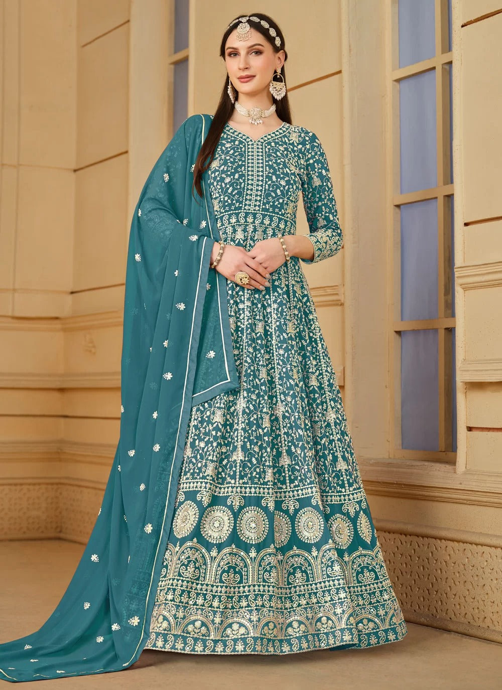 Flowy turquoise faux georgette embroidered anarkali suit