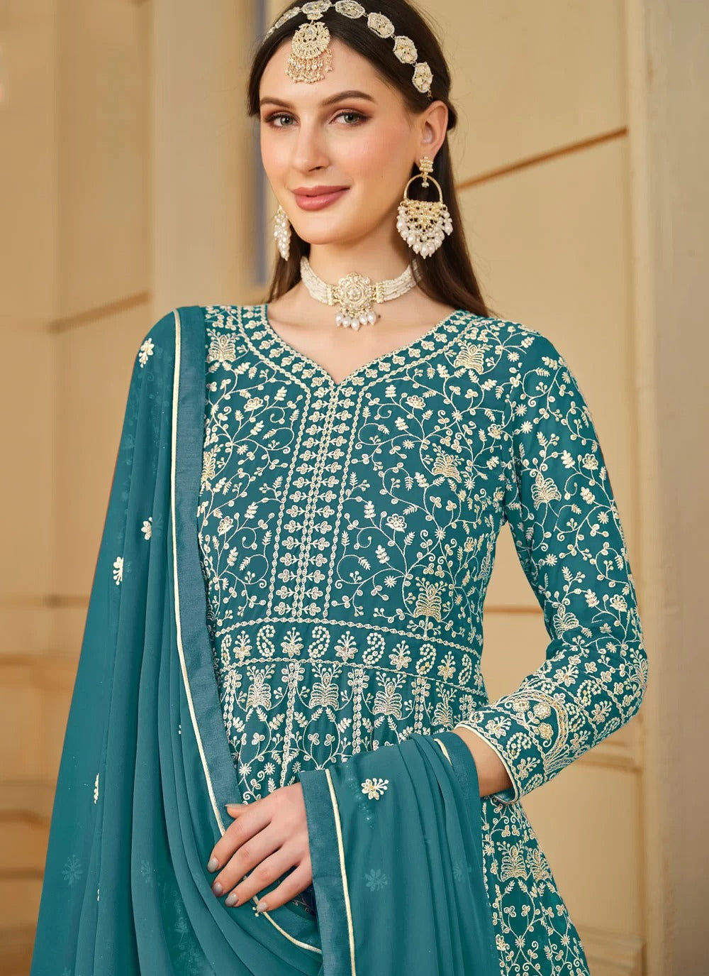 Flowy turquoise faux georgette embroidered anarkali suit