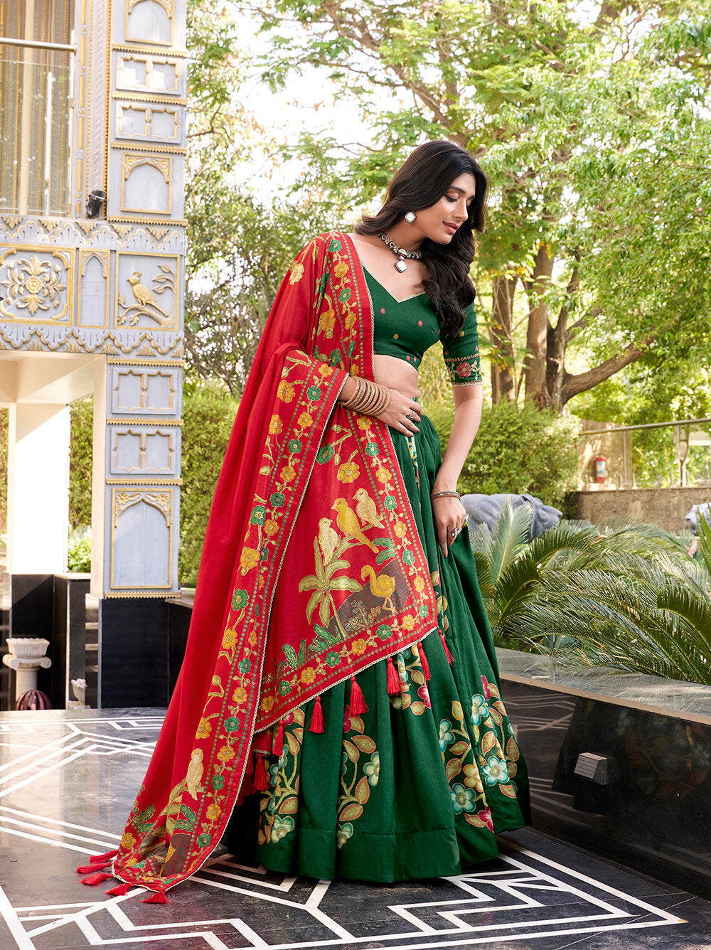 Emerald green tussar silk lehenga choli with foil print lace accents matching dupatta