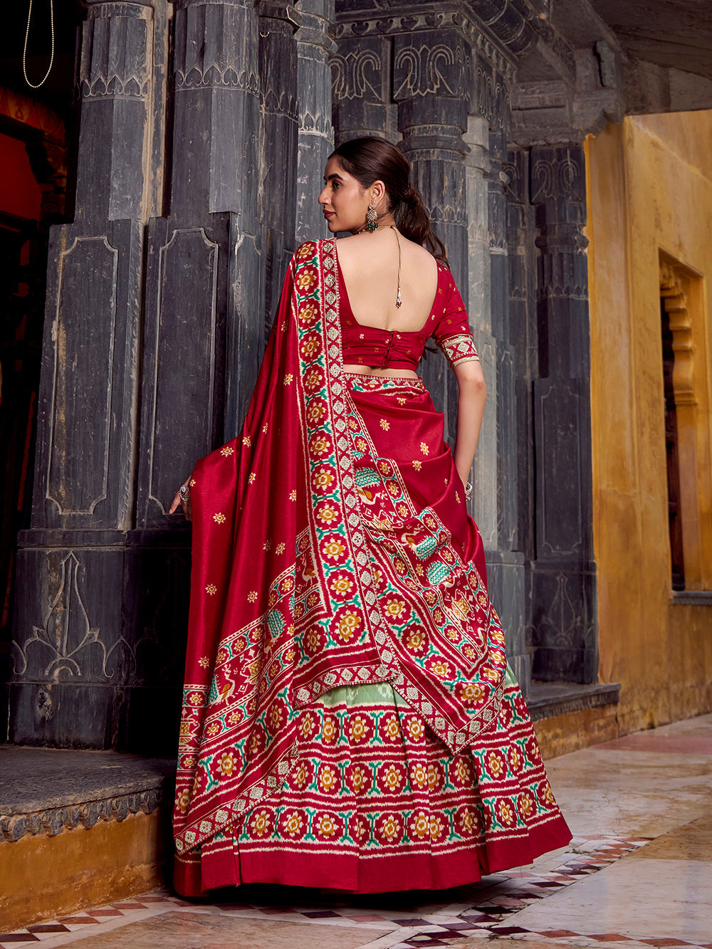 Sea green tasar silk ikat patola print lehenga choli set with red embroidered blouse dupatta