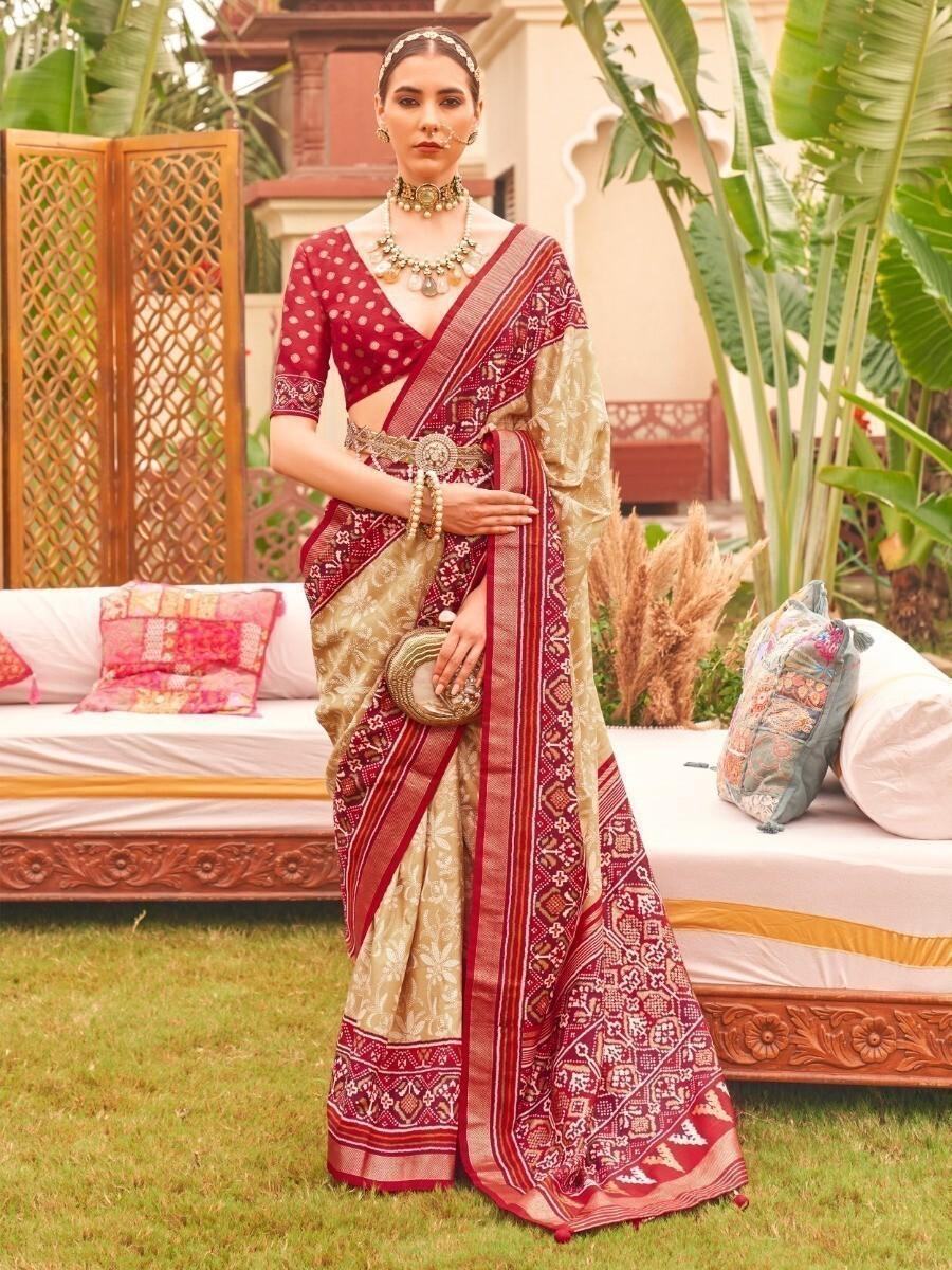 Unbelievable Cream Patola Printed Silk Reception Wear Saree