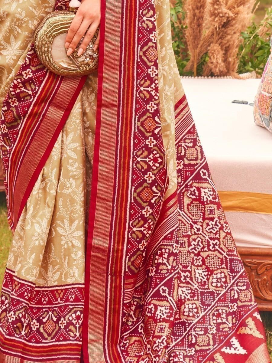 Unbelievable Cream Patola Printed Silk Reception Wear Saree