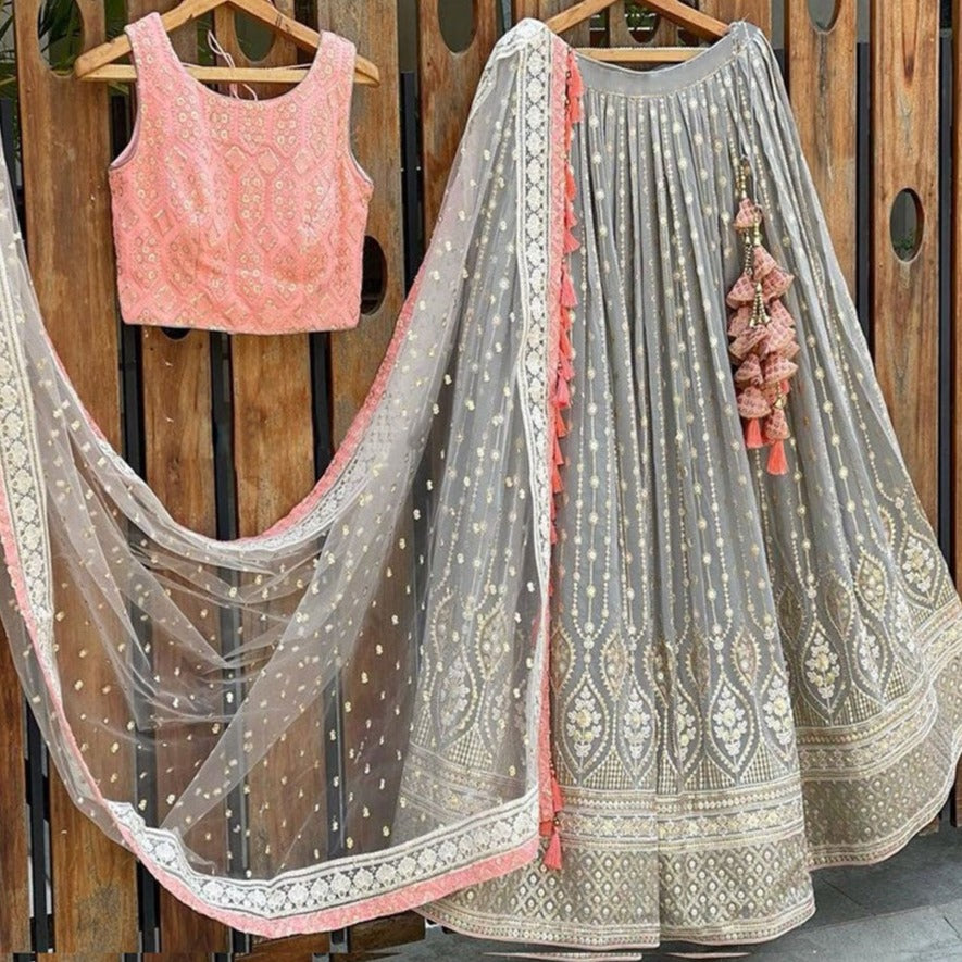 Grey color Lehenga choli with Peach Blouse and Net Dupatta