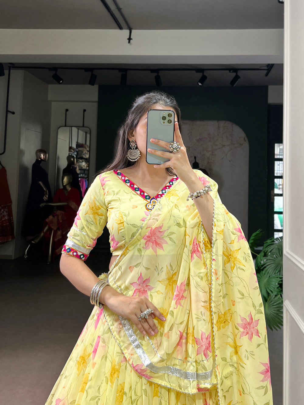 Yellow tubby silk floral printed lehenga choli with mirror work embossed lace detailing