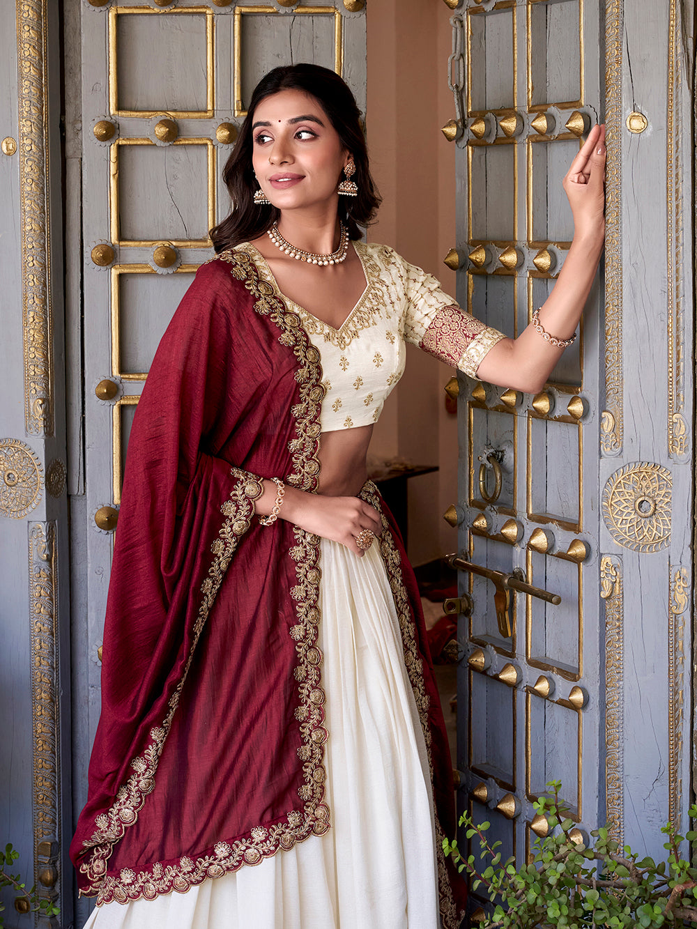 Off white vichitra silk zari weaving lehenga choli with sequin belt dupatta