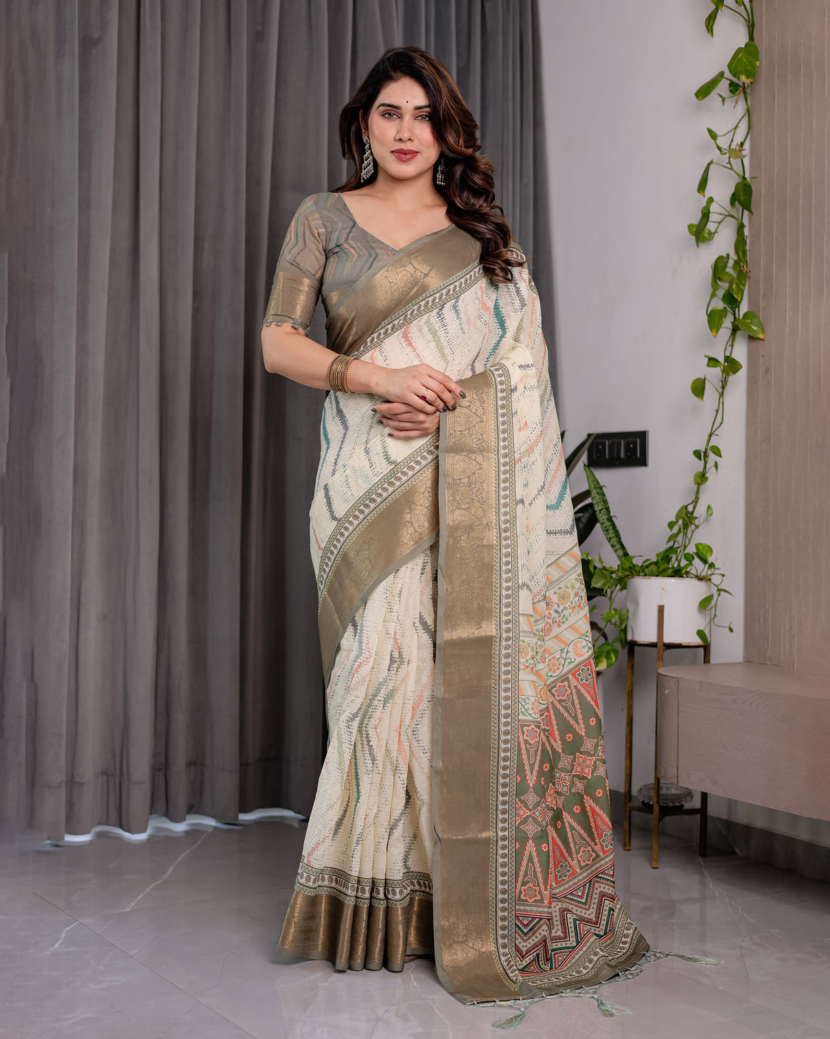 Elegant cream gold woven ikat silk saree with designer border with tassles