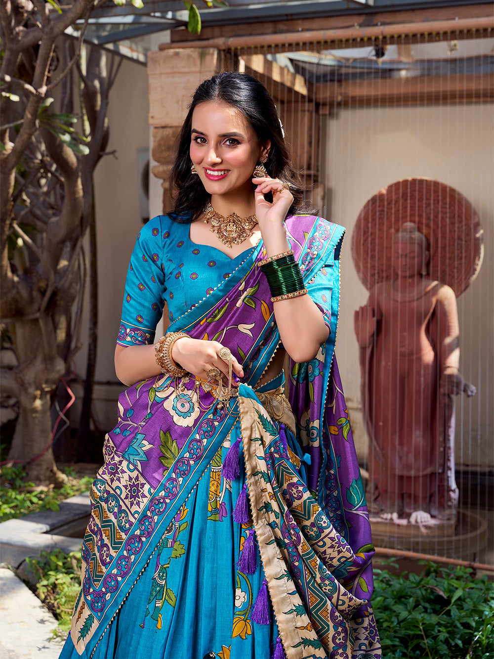 Firozi tussar silk lehenga choli with kalamkari print foil work elegance