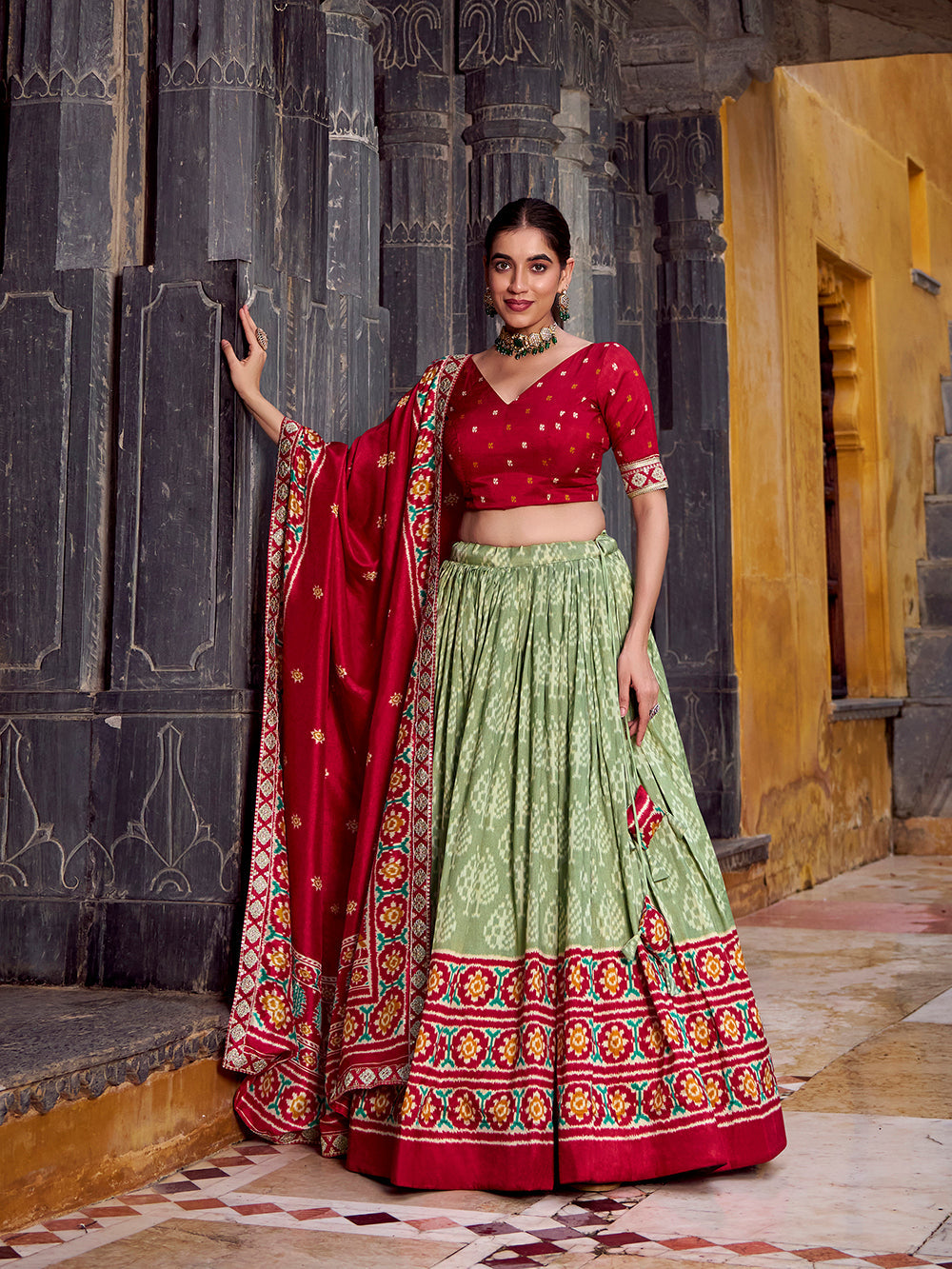 Sea green tasar silk ikat patola print lehenga choli set with red embroidered blouse dupatta