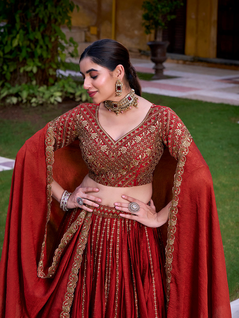 Rust orange rangoli crush party wear lehenga choli with sequins thread embroidery