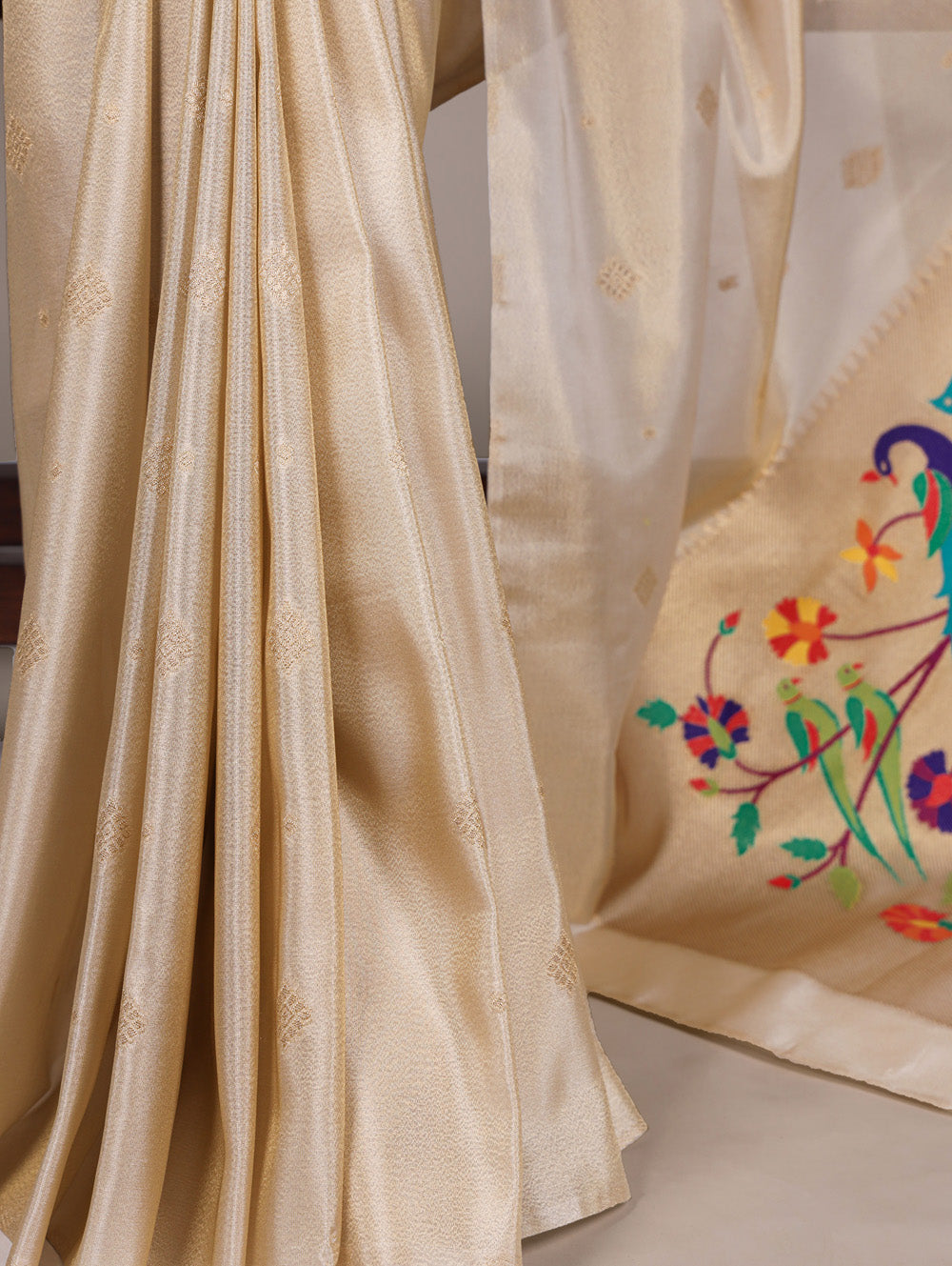 Cream tissue paithani saree with intricate zari weaving unstitched blouse