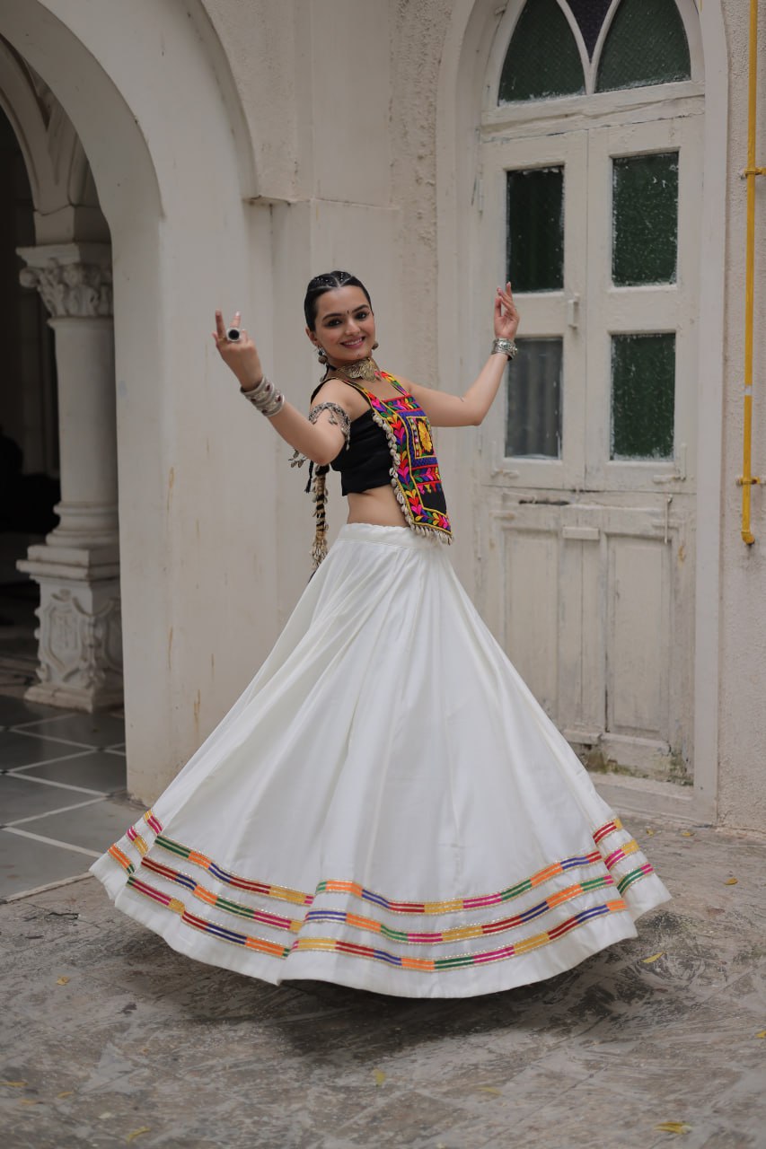 White Festive Roman Fabric Lehenga with black Kutchi Gamthi Embroidered Top