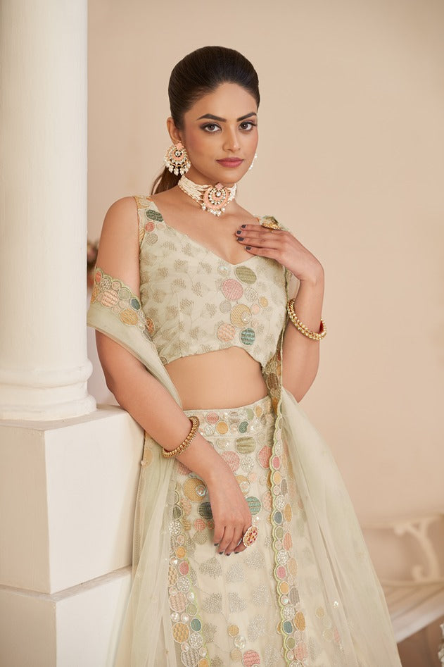 Mesmerizing White Net Lehenga Choli with Multicolor Thread & Sequin Embroidery