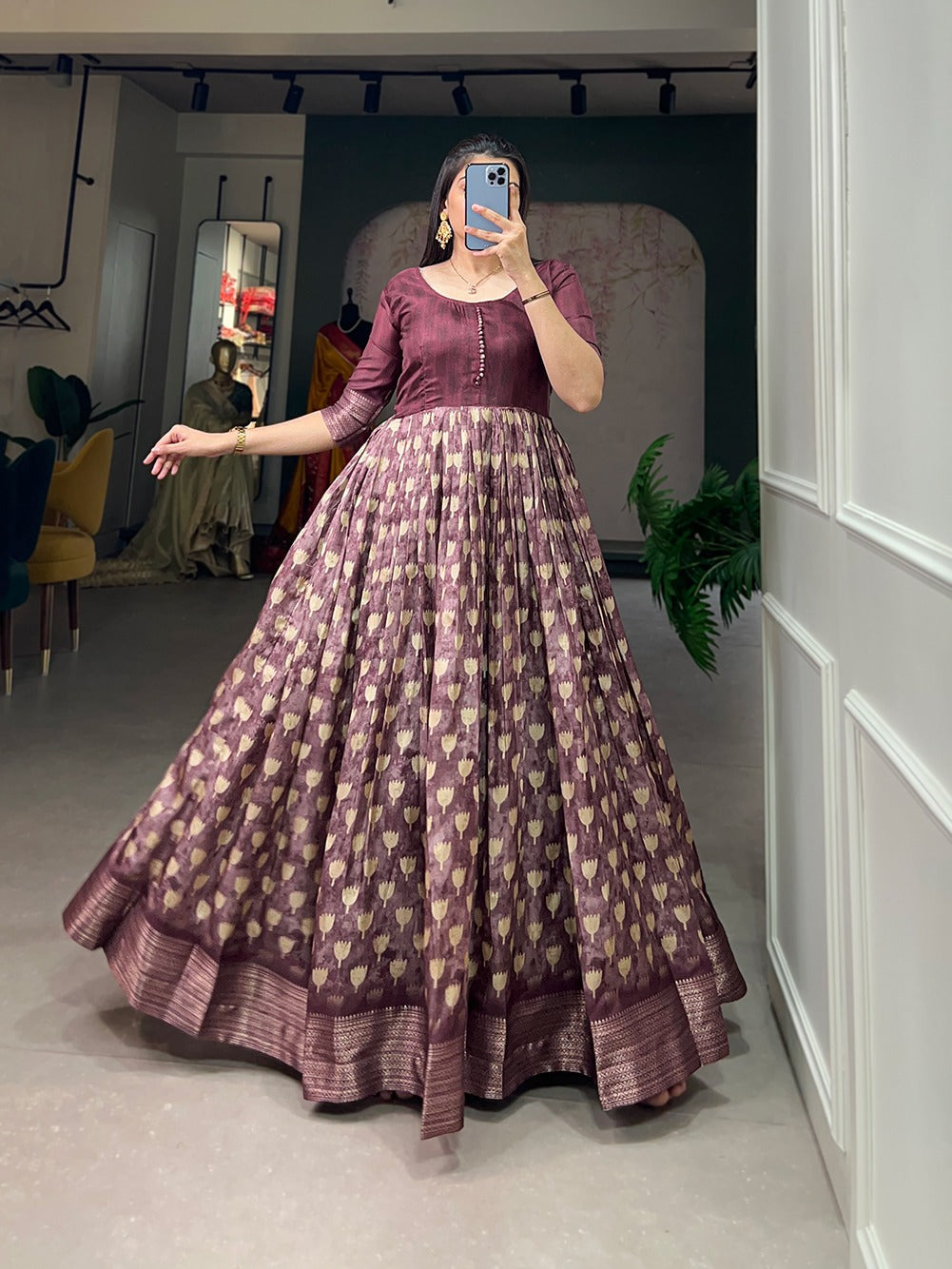 Wine Color Enthralling Dola Silk Gown with Printed Design and Luxe Zari Border