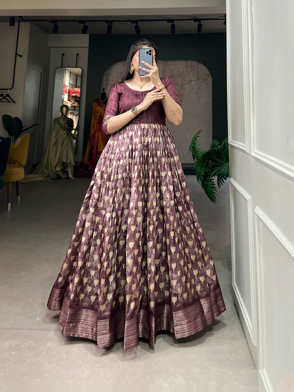 Wine Color Enthralling Dola Silk Gown with Printed Design and Luxe Zari Border