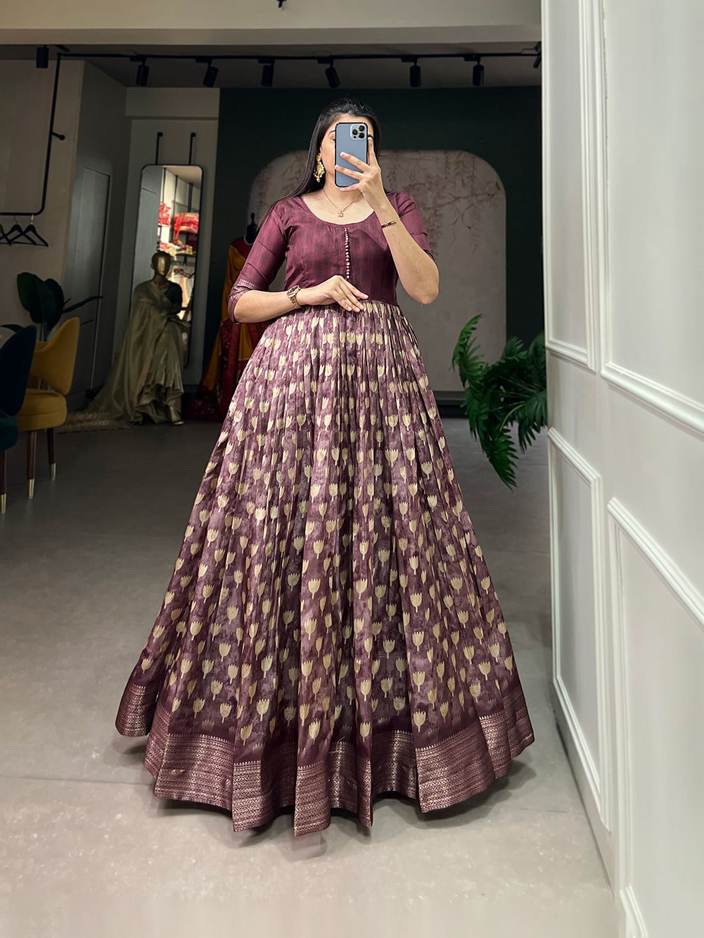 Wine Color Enthralling Dola Silk Gown with Printed Design and Luxe Zari Border
