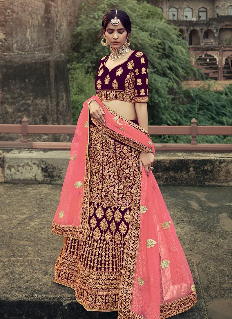 Wine Color Satin Fabric Stone Work Lehenga With Net Dupatta