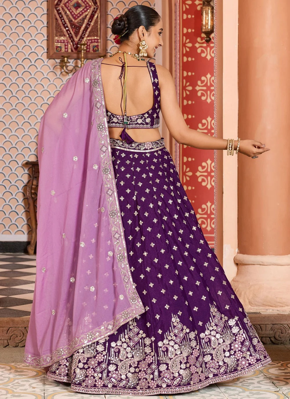 Opulent burgundy engagement lehenga in tissue silk with zari sequins embroidery