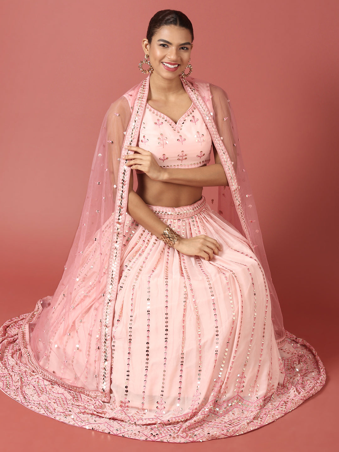 Women Peach Net Sequinse Embroidered Semi-Stitched Lehenga & Blouse with Dupatta