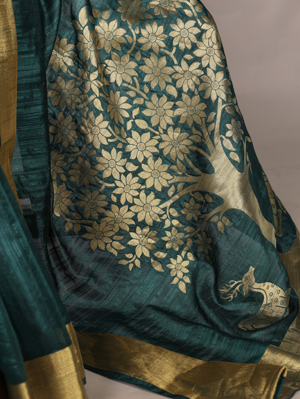 Green raw silk saree with intricate zari weaving unstitched blouse