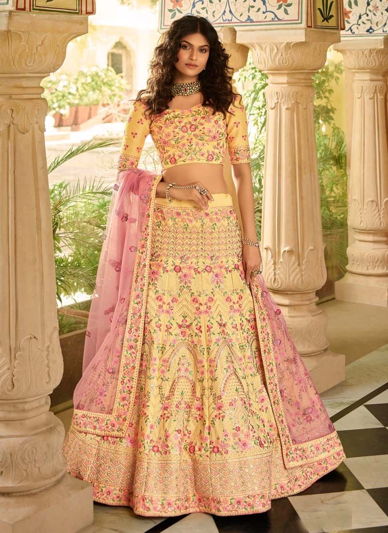 Yellow art silk stone work lehenga choli for reception