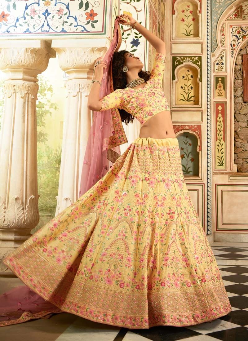 Yellow art silk stone work lehenga choli for reception