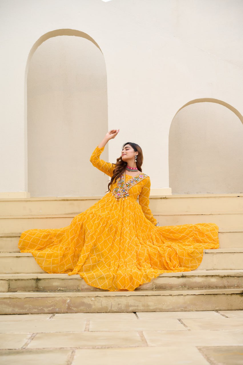 Yellow Bandhani Print Faux Georgette Gown with Kutchi Patchwork