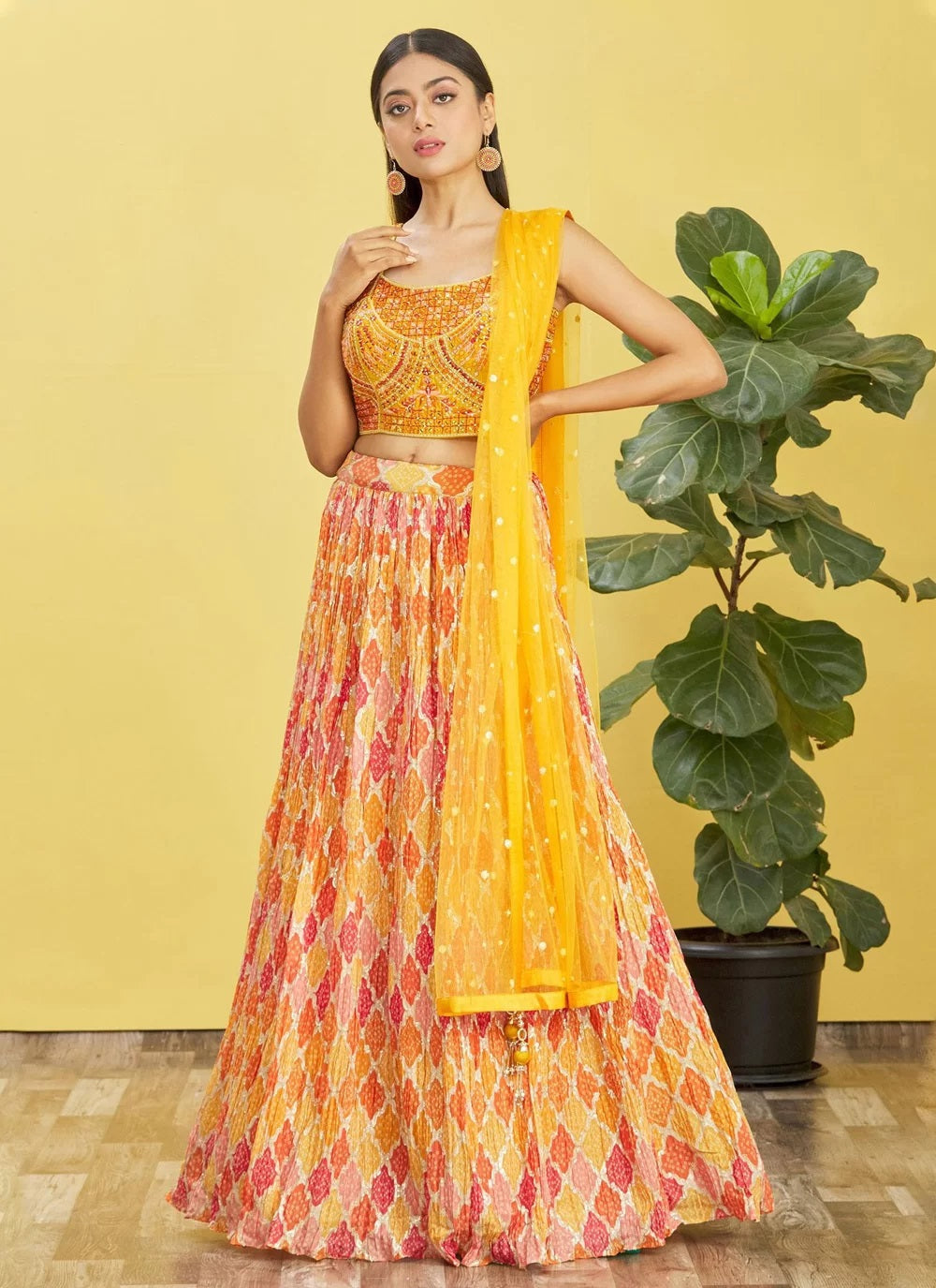 Yellow chinnon mirror sequins and printed work party wear lehenga