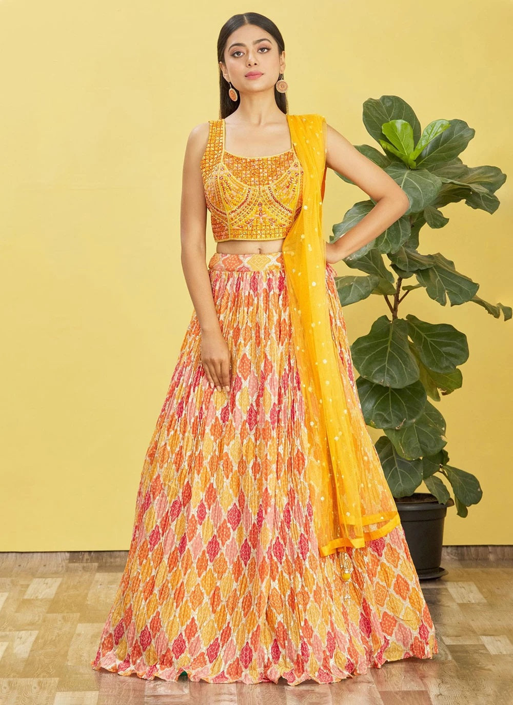 Yellow chinnon mirror sequins and printed work party wear lehenga