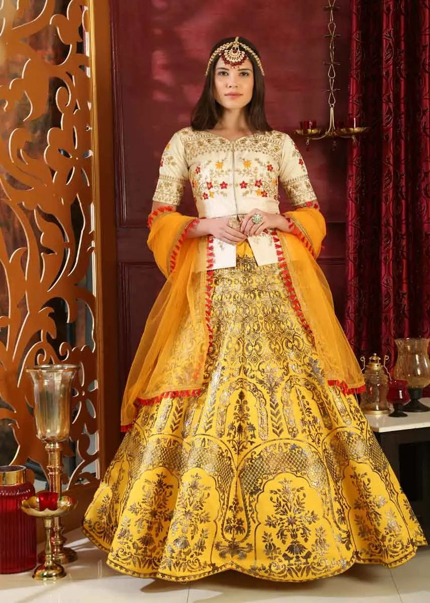 Yellow color silk metalic foil work bridal lehenga