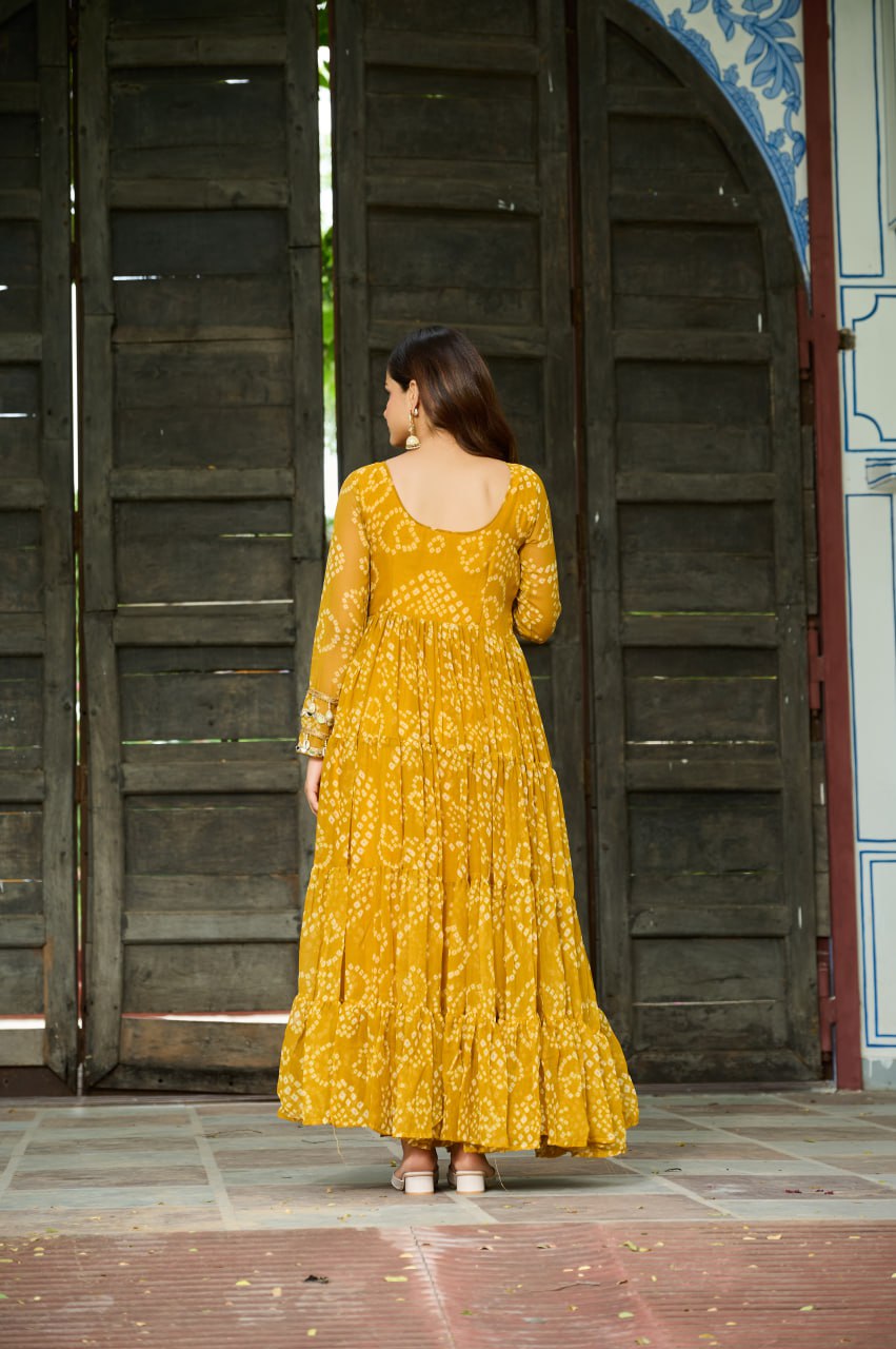 Yellow Faux Georgette Bandhani Print Gown with Kutchi Patchwork – Full Sleeves, 12 Meter Flair, Cotton Lining