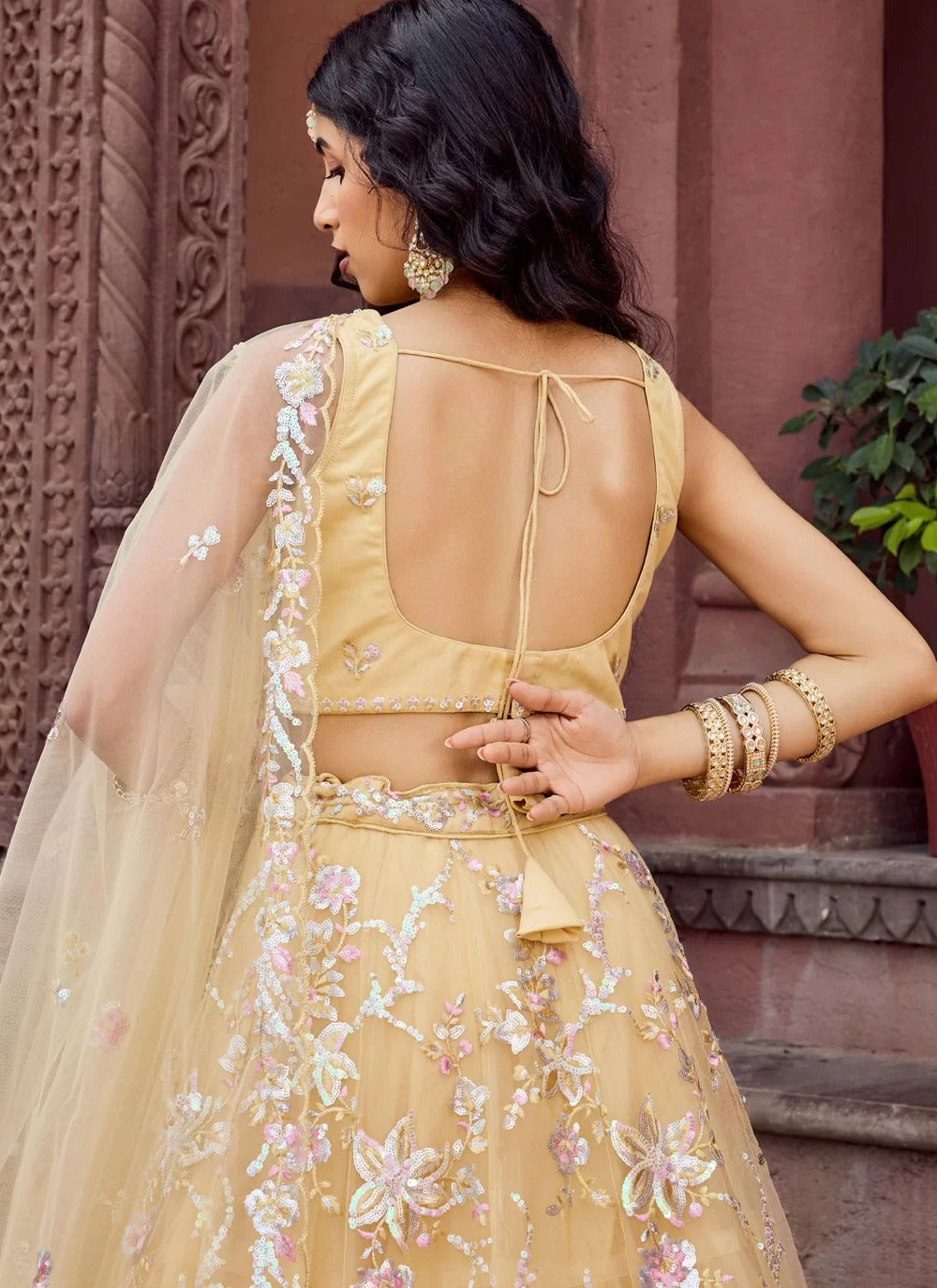 Bright yellow net haldi ceremony lehenga choli with embroidery