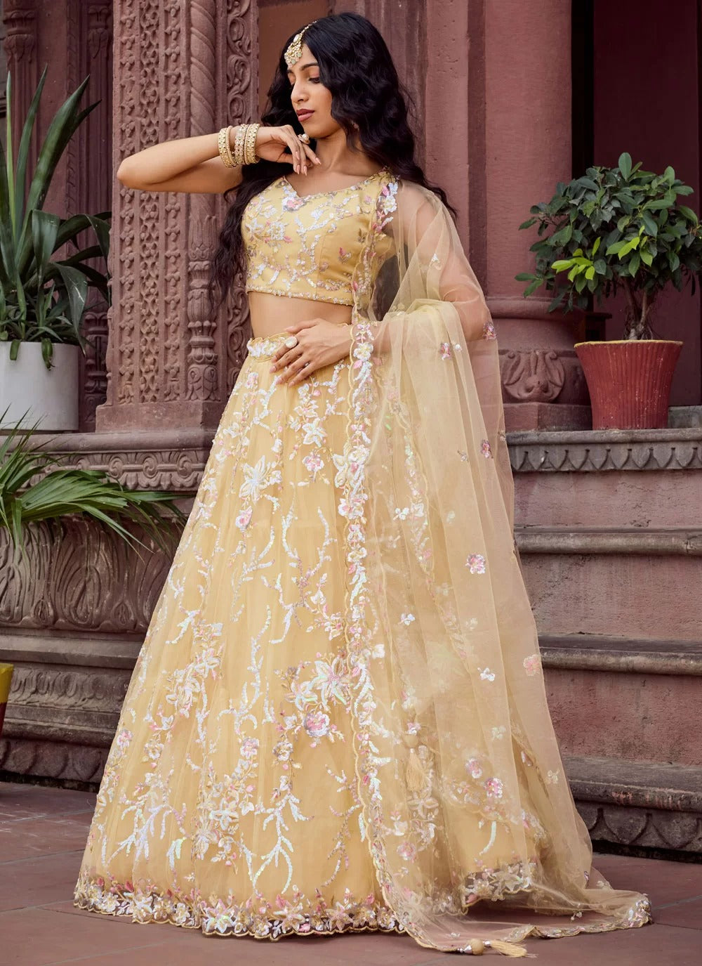 Bright yellow net haldi ceremony lehenga choli with embroidery