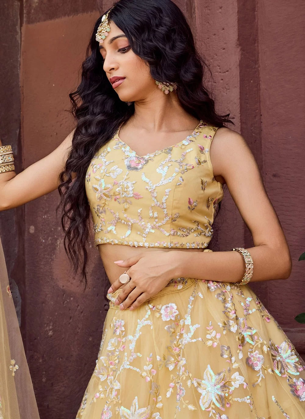 Bright yellow net haldi ceremony lehenga choli with embroidery