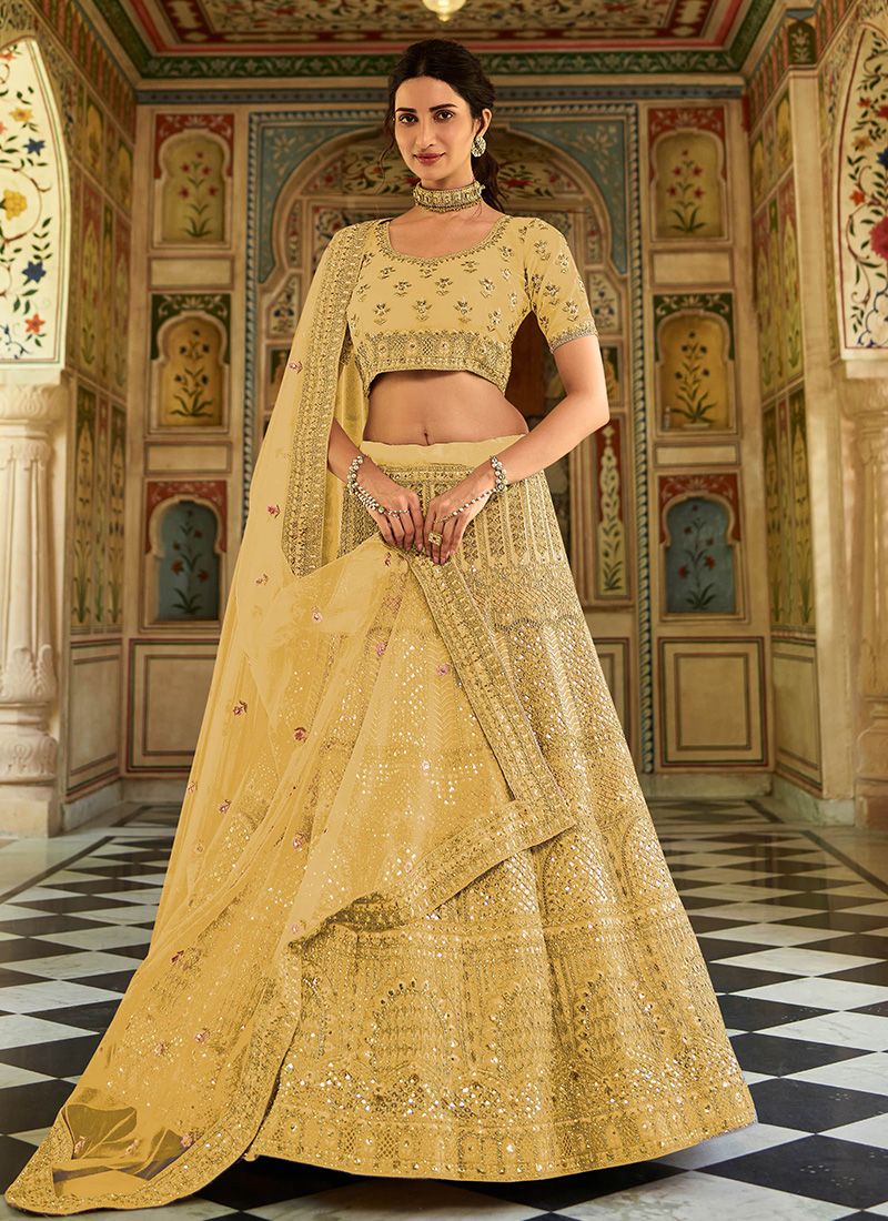 Yellow organza indian wedding lehenga with net dupatta