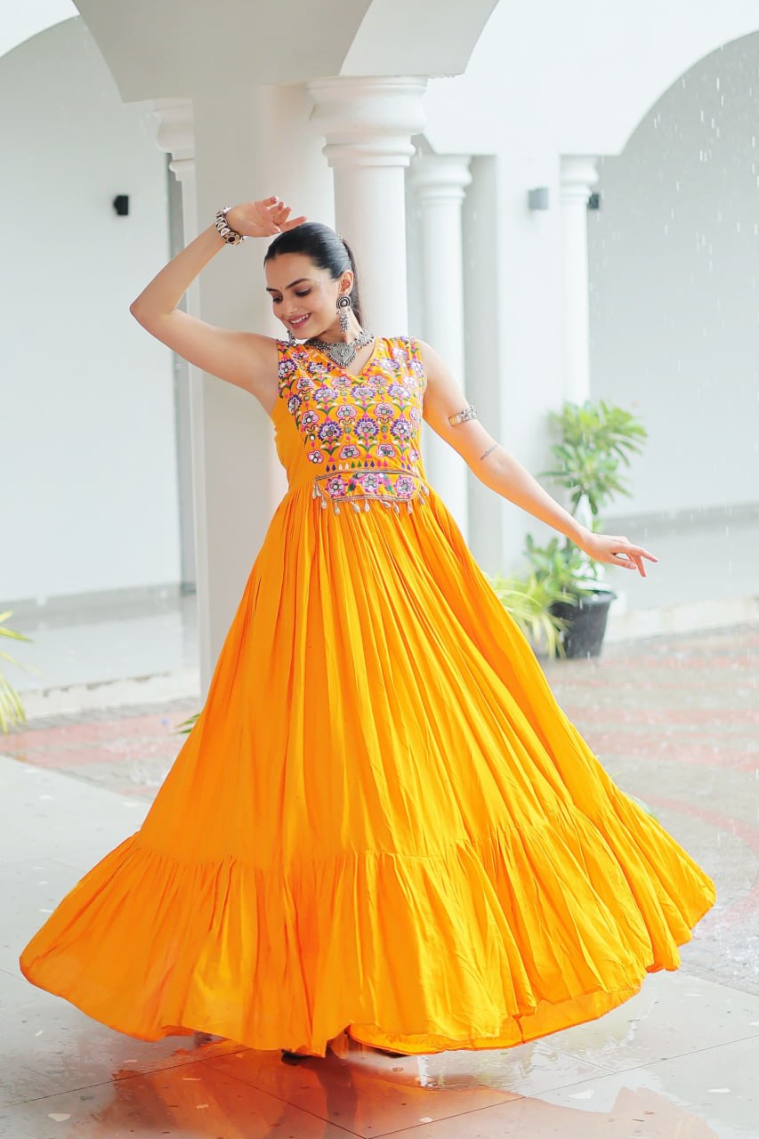 Yellow Rayon Navratri Gown with Kutchi Gamthi Embroidery & Mirror Work – Sleeveless with Flair